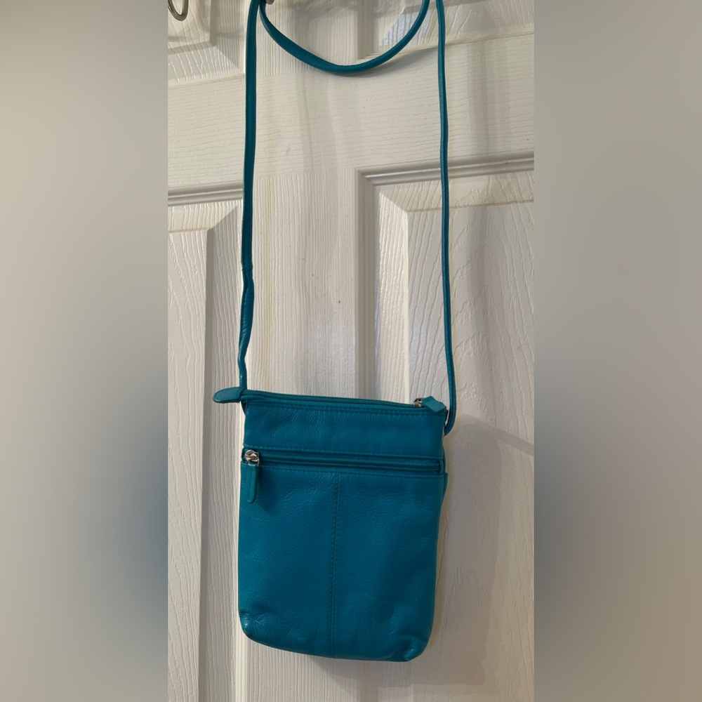 EUC Genuine Leather Mini Teal Crossbody Bag by iIi New York.
